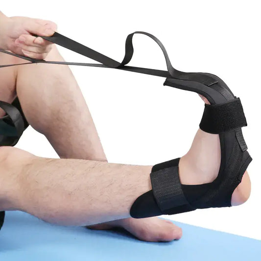 Person using a FlexiRehab stretch band for mobility exercises to stretch ankles and calves.
