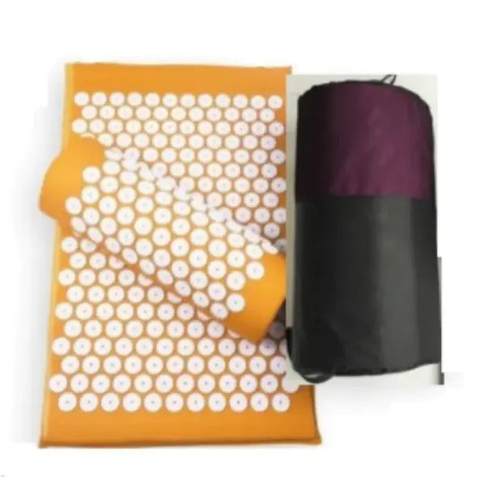 Yoga acupressure mat and pillow set with an orange mat, white pressure points, and a black storage bag for easy carrying.